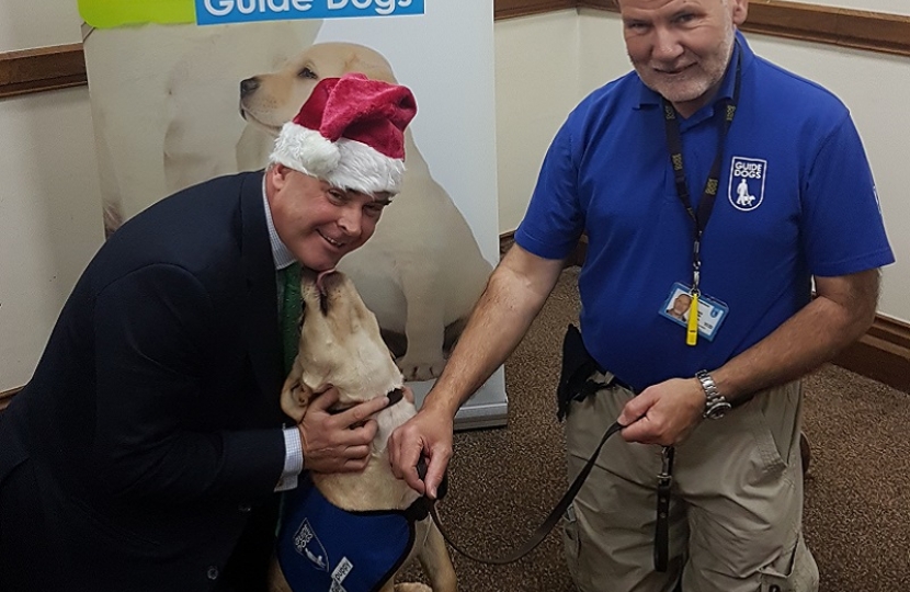 Tim Loughton MP gets a visit from Guide Dogs’ Santa Paws this Christmas